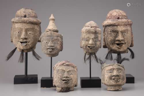 Six Burmese wooden puppet heads
