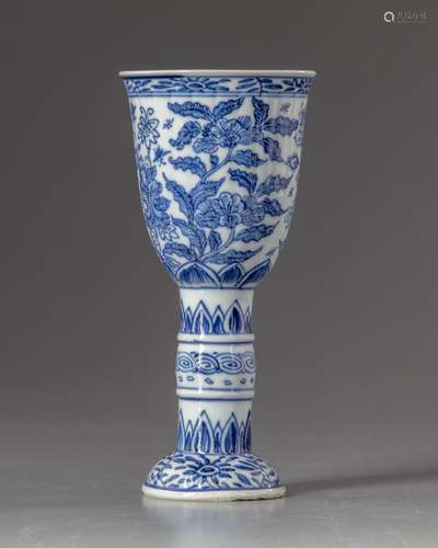 A blue and white stem beaker