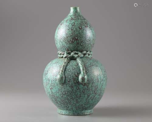 A turquoise ground red splashed double gourd vase