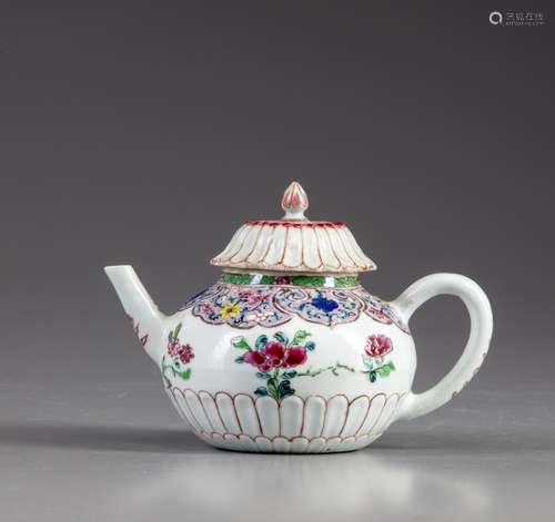 A Chinese famille rose moulded teapot and cover