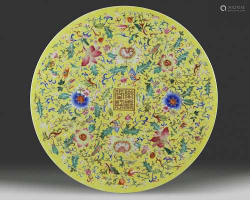 A massive Chinese yellow-ground famille rose circular plaque