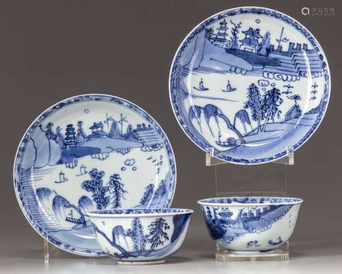 two cups and saucers decorated with multi-levels pavilions in a landscape