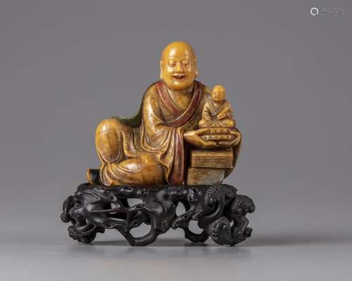 A Chinese soapstone figure of a Luohan