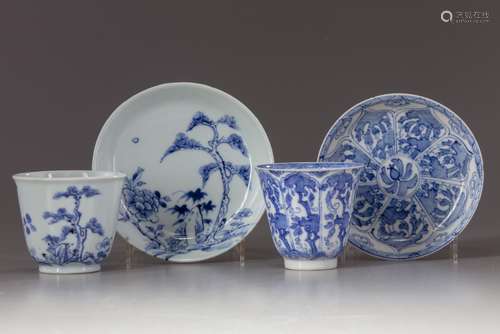 Two blue and white cups and saucers