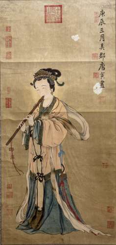 A hand scroll depicting a lady playing the flute