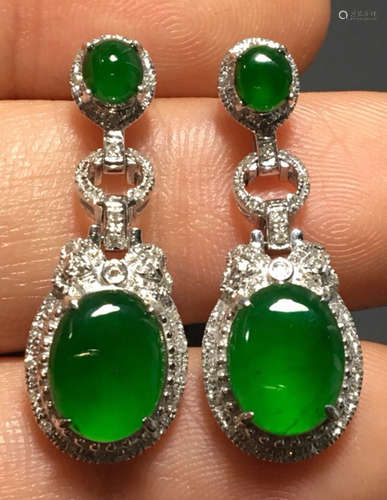 PAIR GREEN JADEITE CARVED CIRCLE EARRINGS, A CLASS