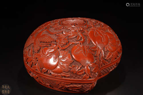 A RED LACQUER CARVED AUSPICIOUS PATTERN BOX