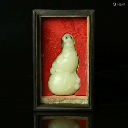 A Chinese Carved Jade Double Gourd Decoration