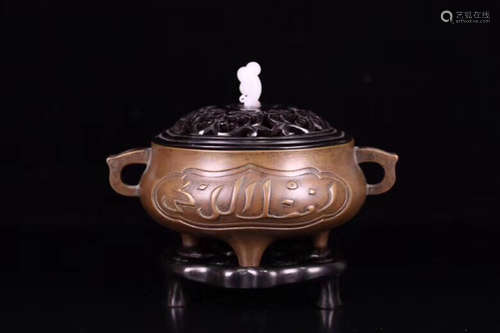 A BRONZE CASTED ARABIC PATTERN EAR CENSER