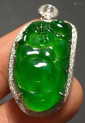 A GREEN JADEITE CARVED BUDDHA PATTERN PENDANT, A CLASS