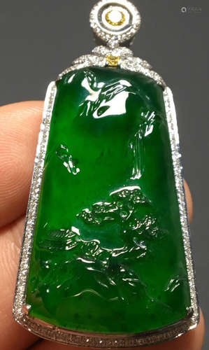 A GREEN JADEITE CARVED LANDSCAPE PATTERN PENDANT, A CLASS