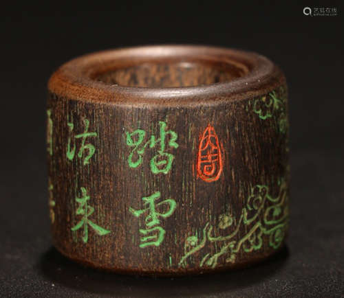 A CHENXIANG WOOD CARVED POETRY PATTERN RING