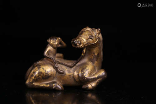 A GILT BRONZE CASTED HORSE SHAPED PENDANT