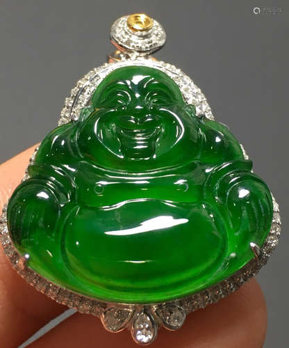 A GREEN JADEITE CARVED BUDDDHA PATTERN PENDANT, A CLASS