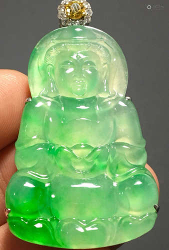 A GREEN JADEITE CARVED GUANYIN PATTERN PENDANT, A CLASS