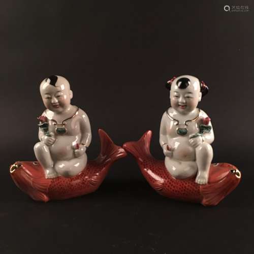 A Pair of Chinese Porcelain 'Li Yu Tong Zi'  Figure