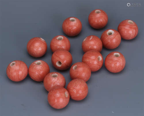 A GROUP OF CHINESE RED PEKING GLASS BEADS