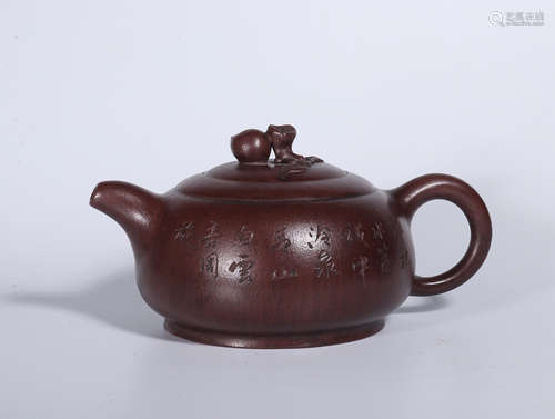 AN OLD VERSE PATTERN PURPLE CLAY TEAPOT