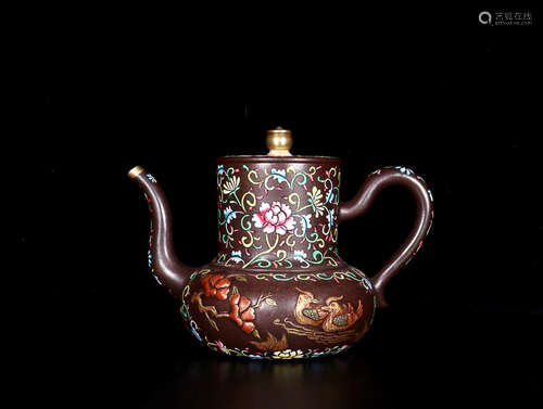 A FLORAL PATTERN PURPLE CLAY TEAPOT