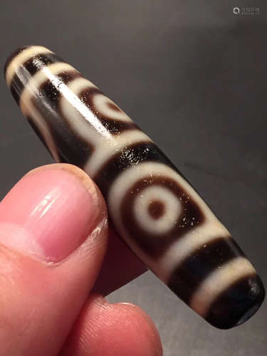 A FOUR-EYE DZI BEAD