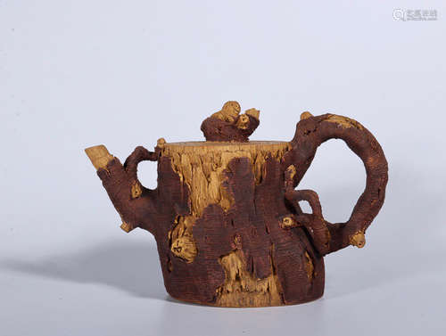 A TREE ROOT DESIGN PURPLE CLAY TEAPOT