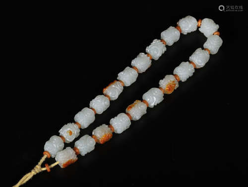 AN OLD HETIAN JADE ROSARY