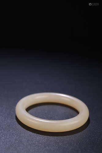 AN OLD HETIAN JADE BANGLE