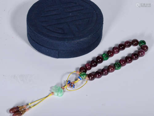 A STRING OF TOURMALINE BEADS