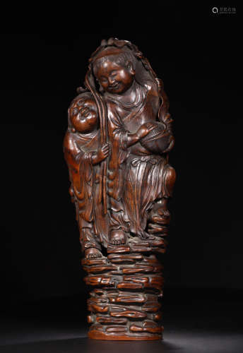 A BAMBOO FIGURE SHAPED ORNAMENT