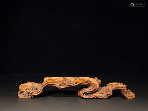 A HUANGYANG WOOD BASE OF WAVING PATTERN