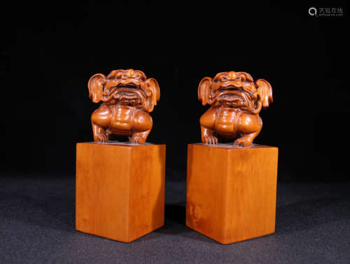 A PAIR OF HUANGYANG WOOD SEALS OF BEAST SHAPED