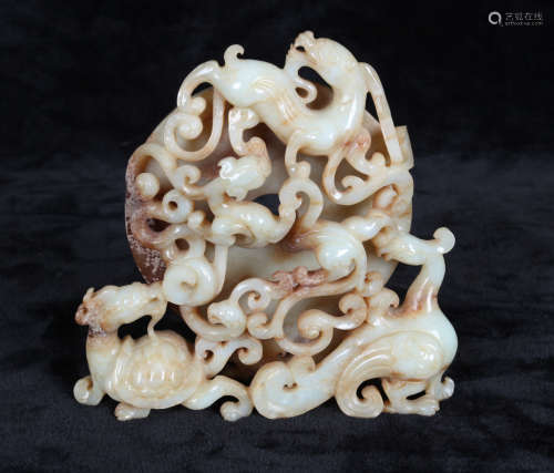 A HETIAN JADE ORNAMENT CARVED IN BEASTS