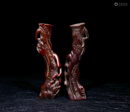 A PAIR OF CHENXIANG WOOD ORNAMENTS