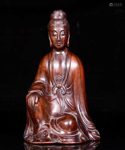 A HUANGHUA WOOD GUANYIN SHAPED ORNAMENT