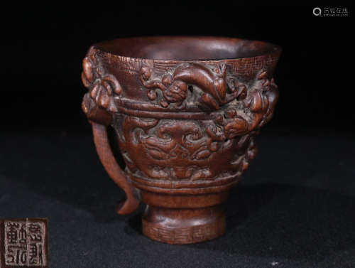 A CHENXIANG WOOD VESSEL CARVED DRAGON PATTERN