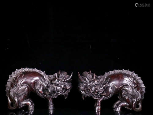 A PAIR OF ZITAN WOOD OF BEAST SHAPED ORNAMENTS