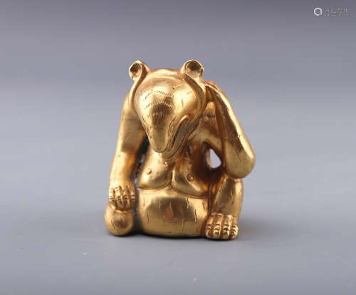 A TANG DYNASTY GILT BRONZE ORNAMENT