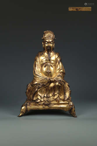 A MING DYNASTY GILT BRONZE FIGURE SHAPED ORNAMENT