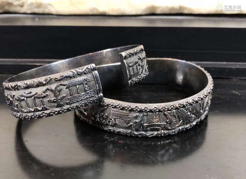 A PAIR OF SILVER BANGLES