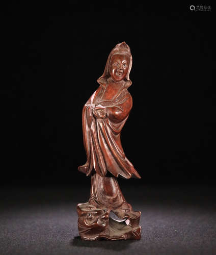 A HUANGYING WOOD GUANYIN SHAPED ORNAMENT