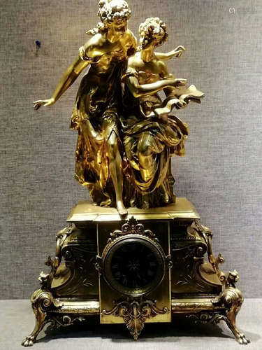 A GILT BRONZE CLOCK OF TWO FIGURES SHAPED