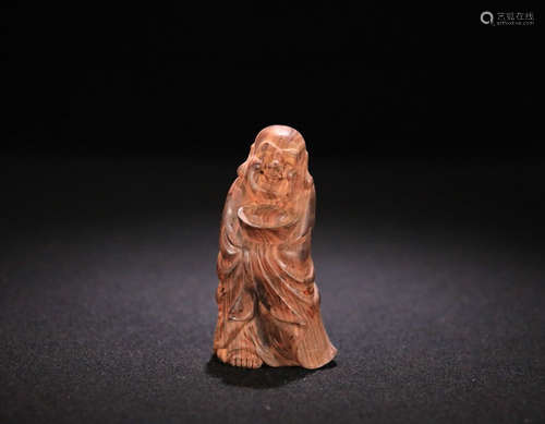 A HUANGHUALI WOOD SMAIL BUDDHA PENDANT