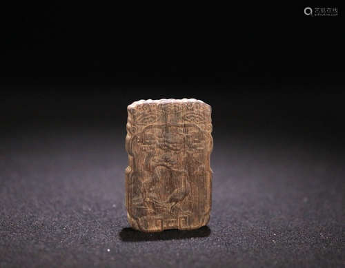 AN OLD CHENXIANG WOOD CAVED BRAND PENDANT