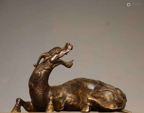 A BRONZE BEAST SHAPED ORNAMENT