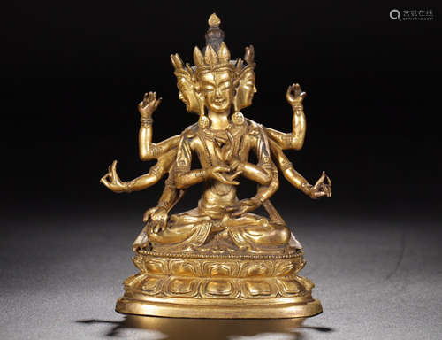 A GILT BRONZE BUDDHA SHAPED ORNAMENT