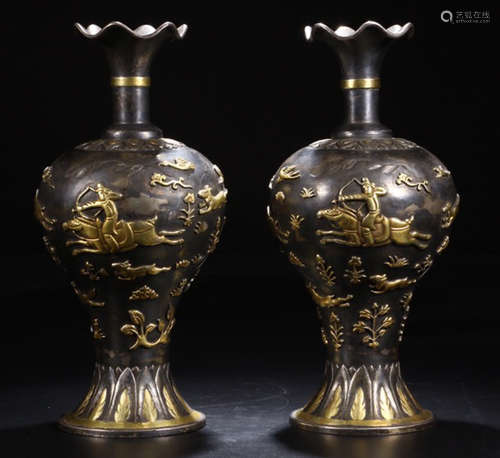 A PAIR OF SILVER VASES