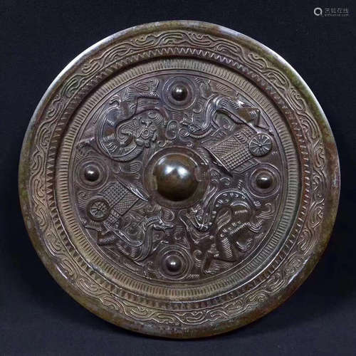 A BRONZE MIRROR OF BEAST PATTERN CARVED