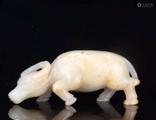 A HETIAN JADE BULL SHAPED ORNAMENT