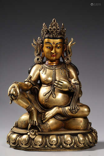 A COPPER GILT JAMBHALA FORTUNE BUDDHA