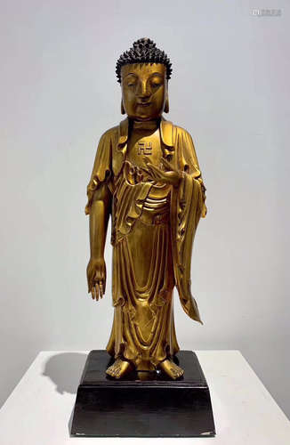 A WOOD BUDDHA SHAPED ORNAMENT OF GOLD PAINTING